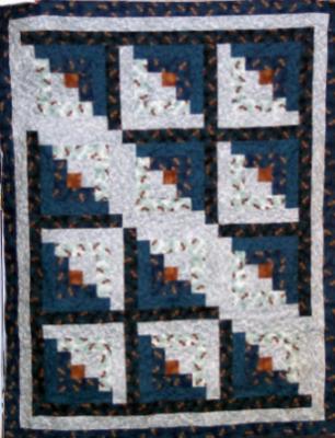 Log Cabin Lap Quilt with matching 14" pillow. Both quilt and pillow were made with Gronola Girl 100% cotton(outdoor) prints,batting is low loft polyester.Machine pieced by Linda Bixby and machine quilted by Linda Monasky. <br />$165.00 for the set