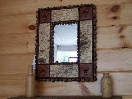 This mirror is surrounded by birch bark white side up and reverse side (brown)in the coners. With acorns & twigs to make it one of a kind by Mike Kazlo 