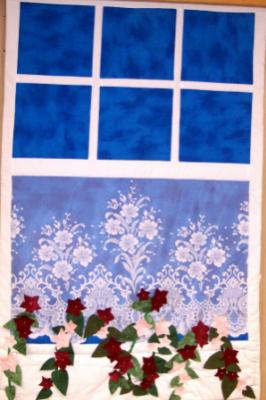 Wallhanging window features a flower box. Top & backing are constructed of quality 100% cotton, batting is low loft polyester.With polyester lace curtain. Machine pieced and machine quilted by Linda Monasky  <br />